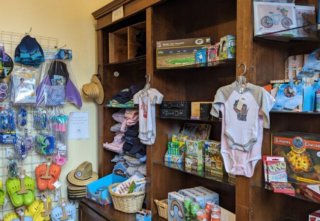 Shop local gifts, apparel, and resort keepsakes at The Elk Trader Osthoff Resort merchandise and souvenirs displayed in The Elk Trader gift shop.