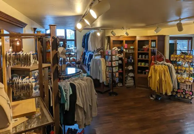 Shop local gifts, apparel, and resort keepsakes at The Elk Trader. Interior of The Elk Trader gift shop at The Osthoff Resort featuring apparel, souvenirs, and local goods.