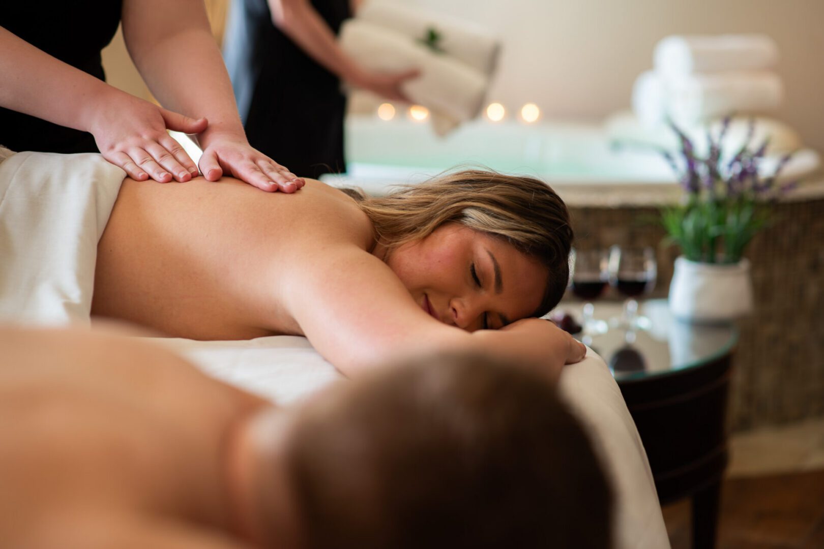 Romantic couple relaxing together at The Osthoff Resort, enjoying a spa experience designed for slowing down and reconnecting.