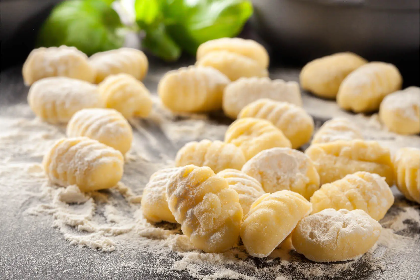 Hands‑on gnocchi cooking class at The Osthoff Resort with students preparing fresh gnocchi and pairing it with savory and sweet sauces.