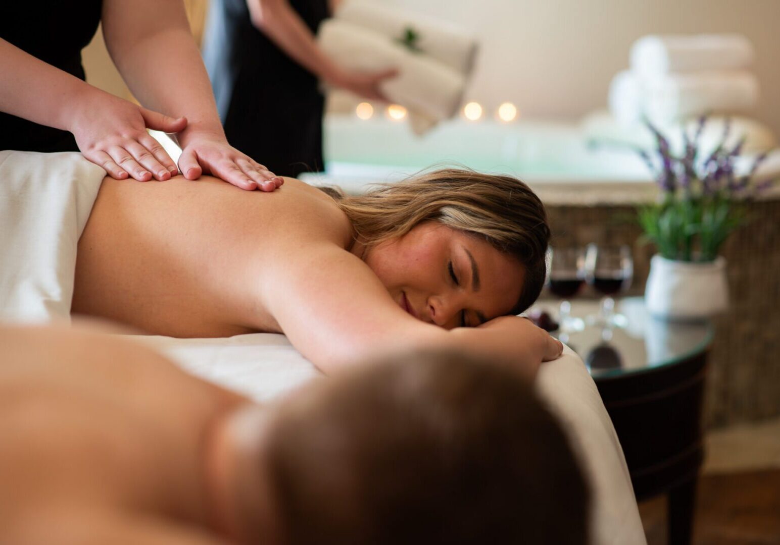Romantic couple relaxing together at The Osthoff Resort, enjoying a spa experience designed for slowing down and reconnecting.