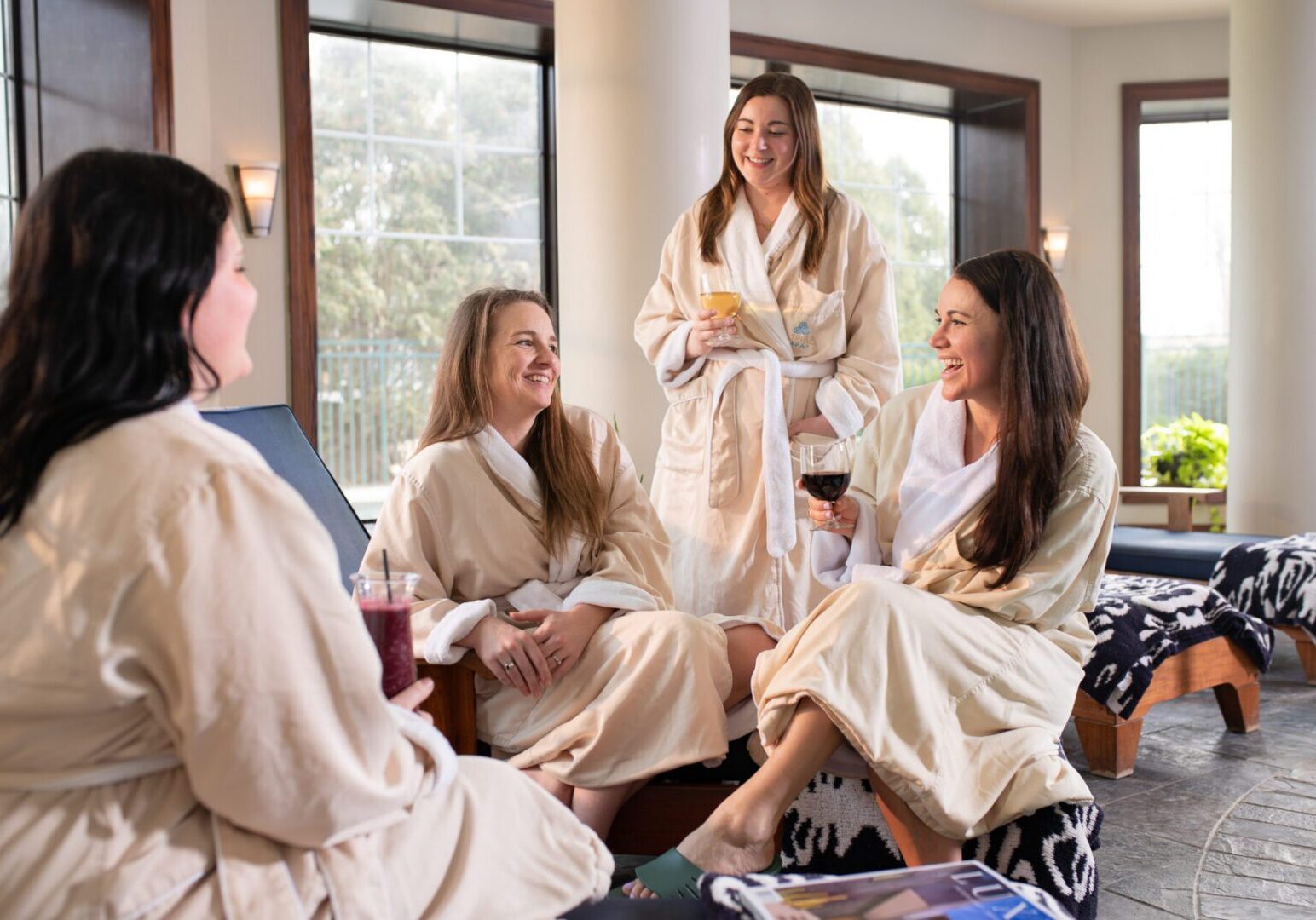 A girlfriends’ getaway at The Osthoff Resort focused on spring and summer vibes around a whirlpool: Alt Text (SEO + Accessibility Friendly) Girlfriends relaxing in an whirlpool at The Osthoff Resort in Elkhart Lake during a sunny spring and summer getaway.