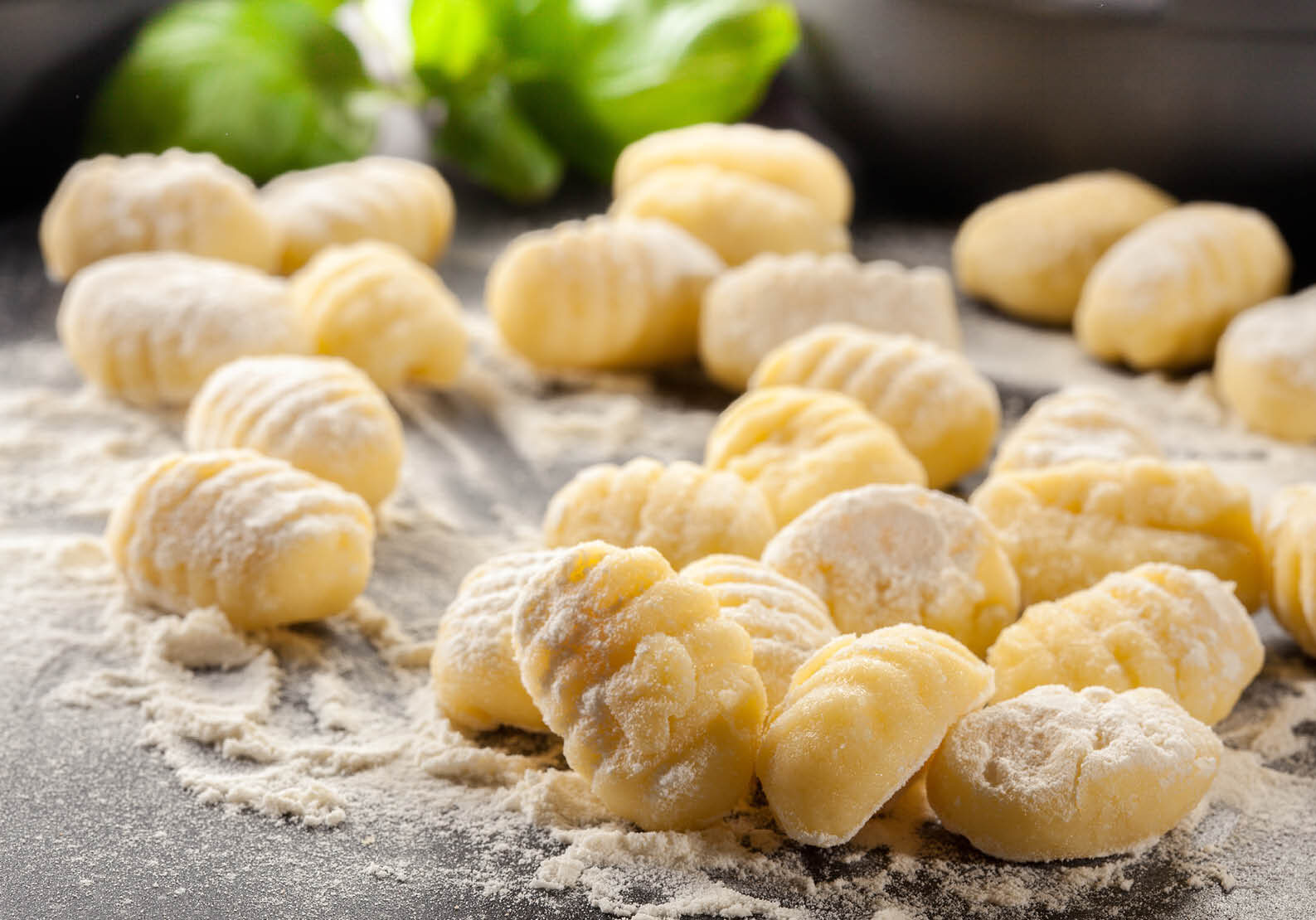 Hands‑on gnocchi cooking class at The Osthoff Resort with students preparing fresh gnocchi and pairing it with savory and sweet sauces.