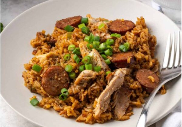 Guests participate in a Louisiana-style cooking class, preparing jambalaya, shrimp and grits, and powdered sugar beignets.