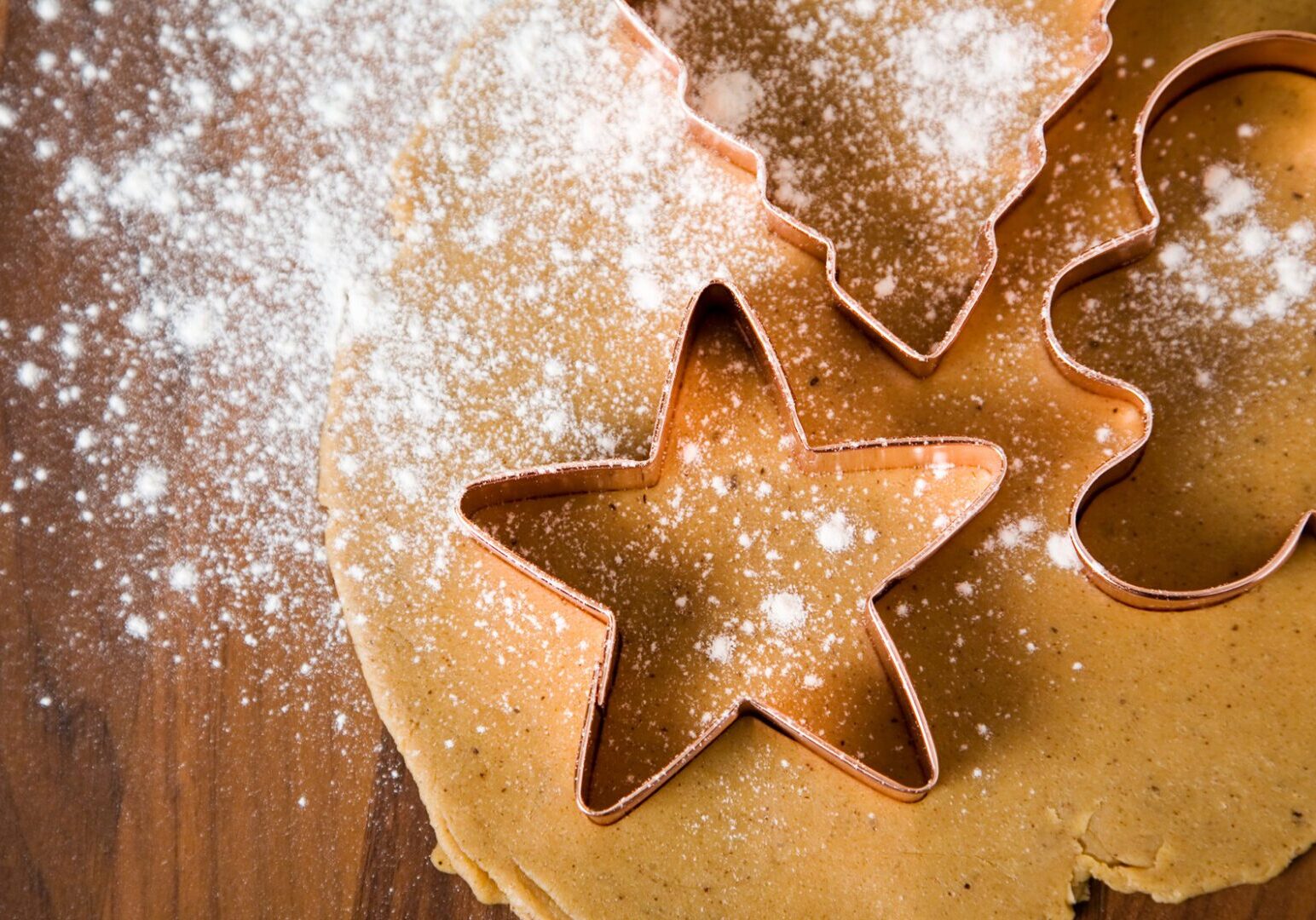 Holiday cookie baking and decorating class at The Osthoff Resort featuring sugar and gingerbread cookies, royal icing, and festive outlining and flooding techniques.