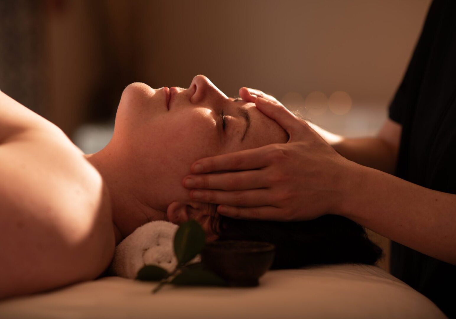 Esthetician performing a brightening Vitamin C Facial at Aspira Spa, The Osthoff Resort.