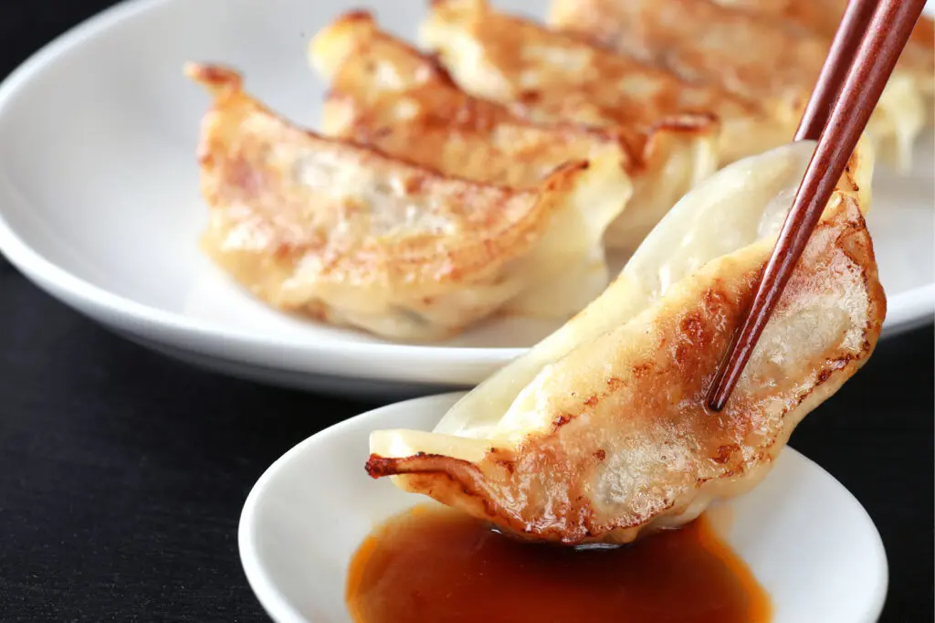 Asian cooking class at The Osthoff Resort featuring pot stickers, egg rolls, and lettuce wraps.