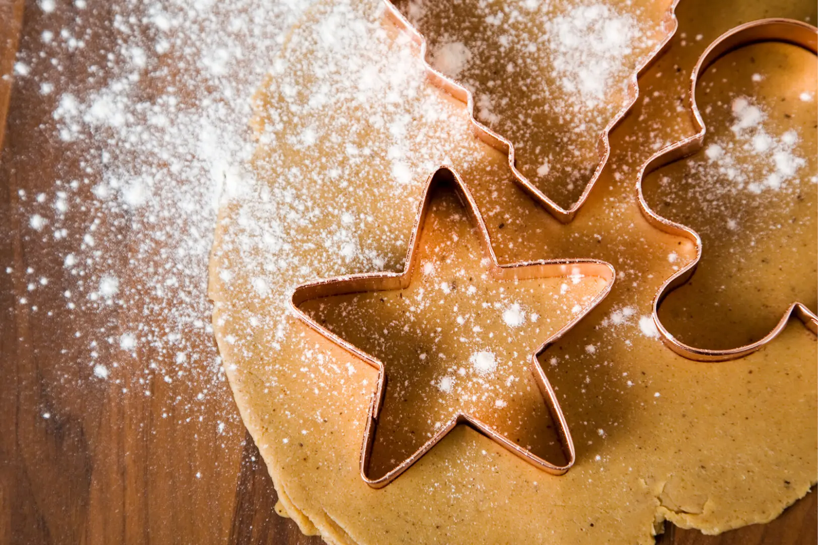 Holiday cookie baking and decorating class at The Osthoff Resort featuring sugar and gingerbread cookies, royal icing, and festive outlining and flooding techniques.