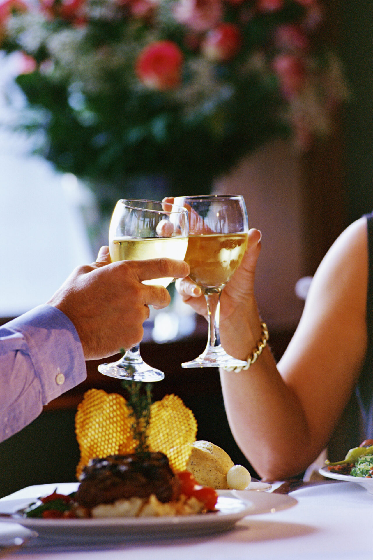 Couples toasting wine